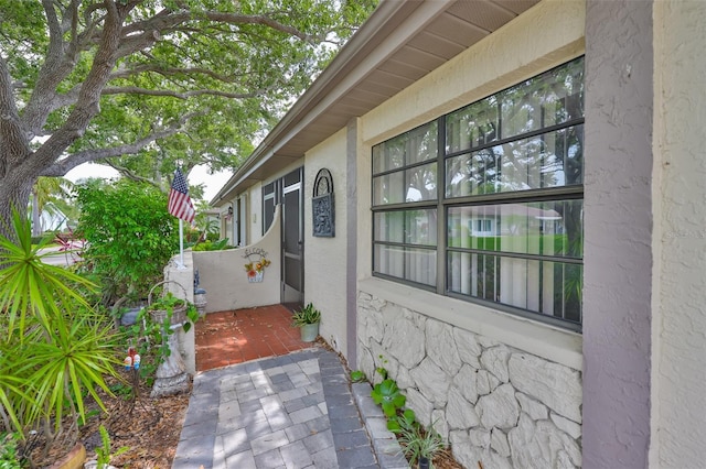 2609 Lancaster Dr, Sun City Center, FL 33573 - view of home's exterior with stucco siding and stone siding