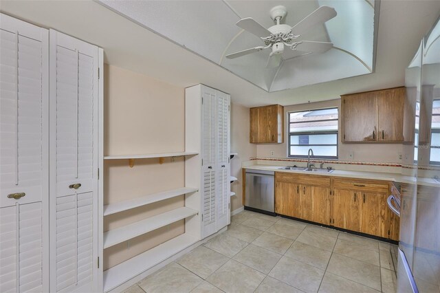 2609 Lancaster Dr, Sun City Center, FL 33573 - kitchen with dishwasher, light countertops, brown cabinetry, and a ceiling fan