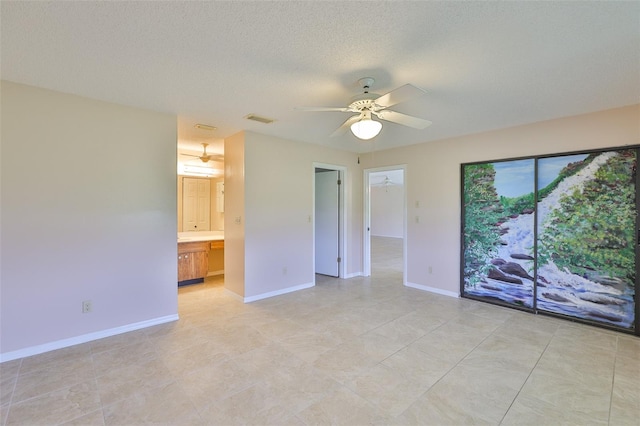 2609 Lancaster Dr, Sun City Center, FL 33573 - unfurnished room featuring a ceiling fan, light tile patterned floors, and a textured ceiling