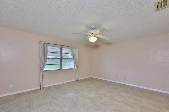 2609 Lancaster Dr, Sun City Center, FL 33573 - unfurnished room featuring a ceiling fan, a textured ceiling, and light tile patterned floors