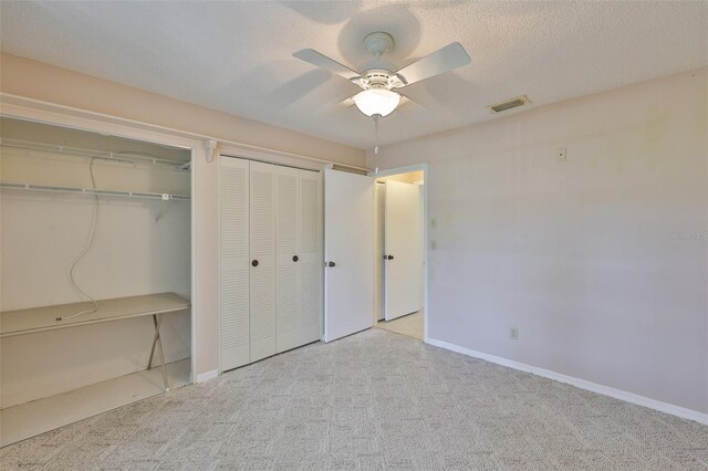2609 Lancaster Dr, Sun City Center, FL 33573 - unfurnished bedroom featuring two closets, carpet floors, and ceiling fan