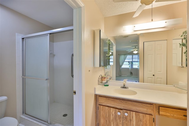 2609 Lancaster Dr, Sun City Center, FL 33573 - bathroom with a ceiling fan, a stall shower, and vanity