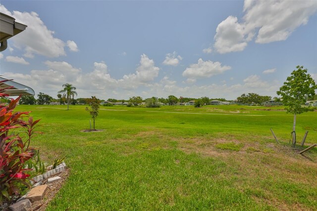 2609 Lancaster Dr, Sun City Center, FL 33573 - view of grassy yard with view of golf course
