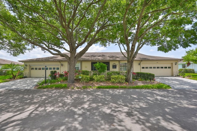 2609 Lancaster Dr, Sun City Center, FL 33573 - single story home with a garage, concrete driveway, and stucco siding