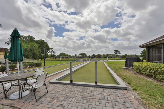 2609 Lancaster Dr, Sun City Center, FL 33573 - view of patio / terrace featuring a game area