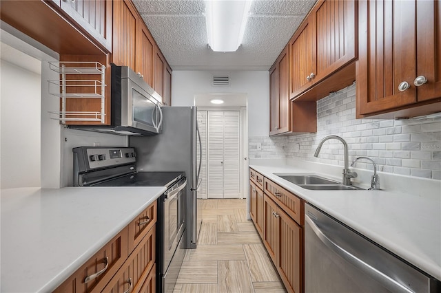 3325 Bayshore Blvd Unit A17, Tampa, FL 33629 - kitchen with appliances with stainless steel finishes, backsplash, light countertops, and brown cabinetry