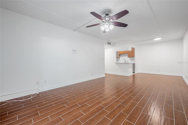 3325 Bayshore Blvd Unit A17, Tampa, FL 33629 - unfurnished living room featuring ceiling fan and dark wood-style flooring