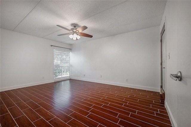 3325 Bayshore Blvd Unit A17, Tampa, FL 33629 - empty room featuring a ceiling fan, dark wood finished floors, and a textured ceiling