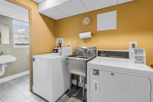 700 Beach Dr NE Unit 602, Saint Petersburg, FL 33701 - community laundry room featuring separate washer and dryer and baseboards