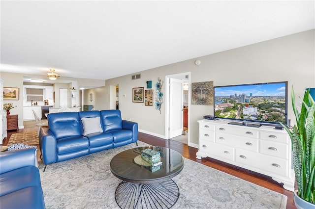 700 Beach Dr NE Unit 602, Saint Petersburg, FL 33701 - living area with wood finished floors and ceiling fan