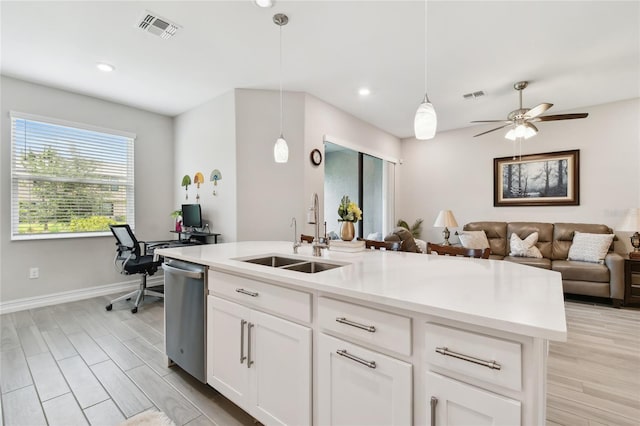 4653 Ancona Way, Wesley Chapel, FL 33543 - kitchen featuring dishwasher, open floor plan, hanging light fixtures, light countertops, and a desk