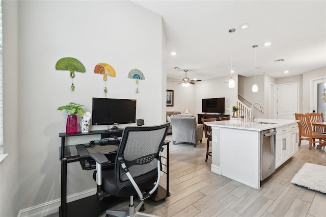4653 Ancona Way, Wesley Chapel, FL 33543 - kitchen with dishwasher, a ceiling fan, open floor plan, white cabinetry, and light countertops