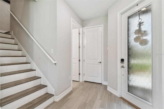 4653 Ancona Way, Wesley Chapel, FL 33543 - foyer featuring stairs, plenty of natural light, and light wood-style floors