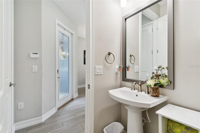 4653 Ancona Way, Wesley Chapel, FL 33543 - bathroom with baseboards and wood finished floors