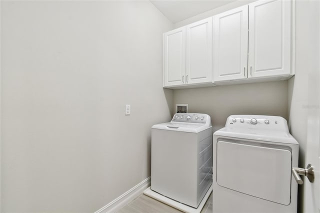 4653 Ancona Way, Wesley Chapel, FL 33543 - laundry area with cabinet space and separate washer and dryer