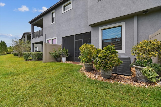 4653 Ancona Way, Wesley Chapel, FL 33543 - back of property with stucco siding and a yard