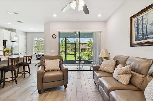 4653 Ancona Way, Wesley Chapel, FL 33543 - living area featuring light wood-style floors, ceiling fan, and recessed lighting