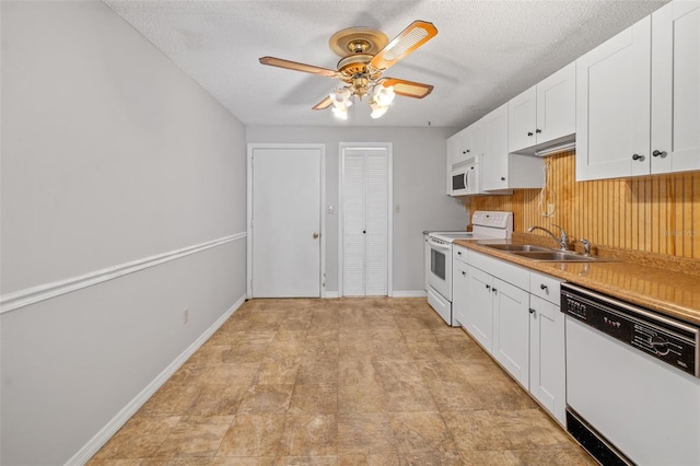 202 Peacock Ln Unit B, Holmes Beach, FL 34217 - kitchen featuring white appliances, white cabinetry, ceiling fan, a textured ceiling, and light countertops