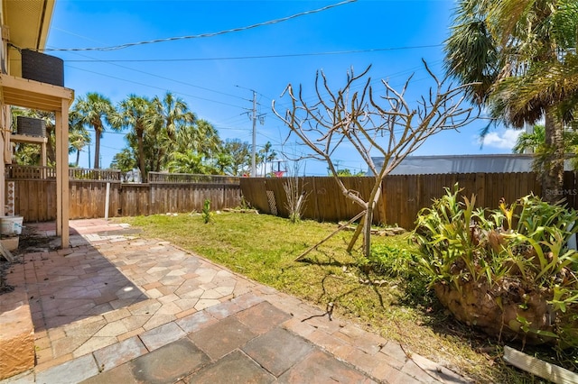 202 Peacock Ln Unit B, Holmes Beach, FL 34217 - fenced backyard with a patio area