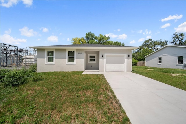 2810 N 75th St, Tampa, FL 33619 - single story home with an attached garage, driveway, and stucco siding