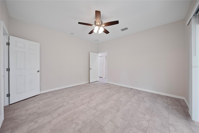 2810 N 75th St, Tampa, FL 33619 - unfurnished bedroom featuring a ceiling fan and baseboards