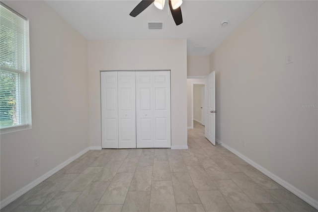 2810 N 75th St, Tampa, FL 33619 - unfurnished bedroom featuring a closet and a ceiling fan