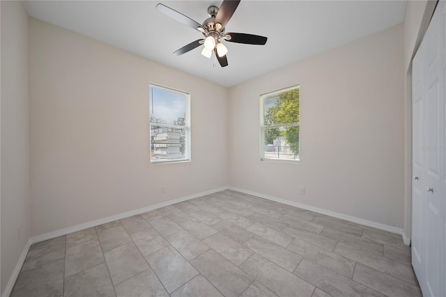 2810 N 75th St, Tampa, FL 33619 - unfurnished room featuring ceiling fan and baseboards