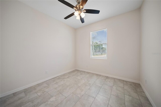 2810 N 75th St, Tampa, FL 33619 - empty room featuring baseboards and a ceiling fan