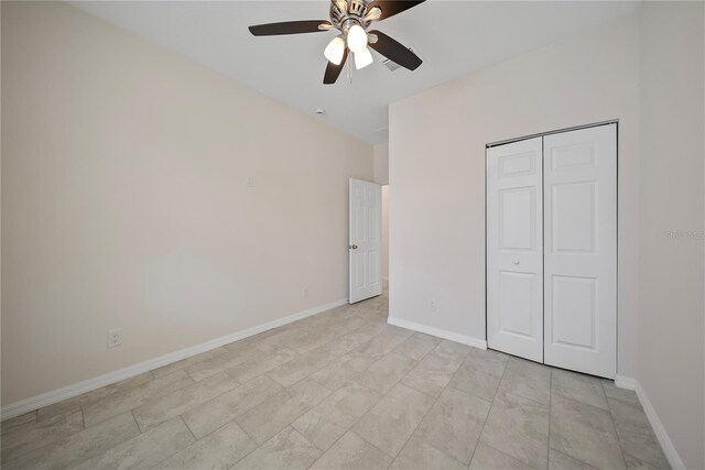 2810 N 75th St, Tampa, FL 33619 - unfurnished bedroom featuring a closet and a ceiling fan