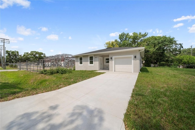 2810 N 75th St, Tampa, FL 33619 - ranch-style house featuring driveway, an attached garage, and stucco siding