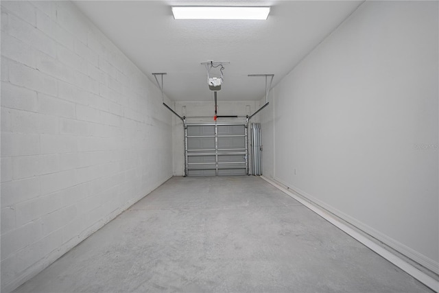 2810 N 75th St, Tampa, FL 33619 - garage featuring a garage door opener and concrete block wall