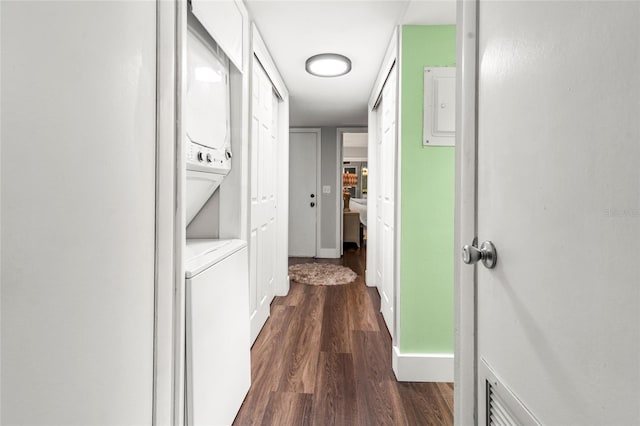 1011 S Moody Ave Unit 11, Tampa, FL 33629 - hallway featuring stacked washer and clothes dryer and dark wood-style flooring