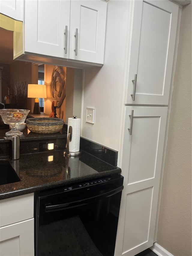 2500 Winding Creek Blvd Unit B105, Clearwater, FL 33761 - kitchen featuring white cabinets, dark stone counters, and black dishwasher