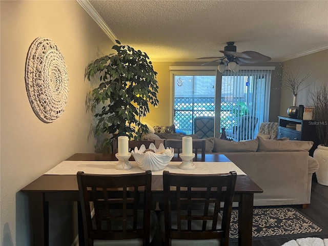 2500 Winding Creek Blvd Unit B105, Clearwater, FL 33761 - dining room featuring ornamental molding, a ceiling fan, a textured ceiling, and wood finished floors