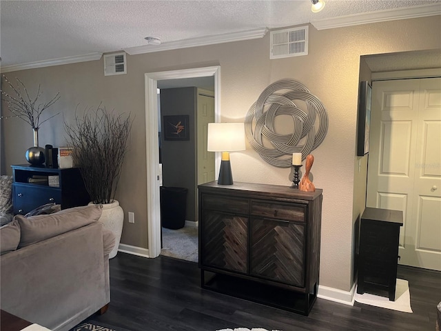 2500 Winding Creek Blvd Unit B105, Clearwater, FL 33761 - living room with crown molding, wood finished floors, and a textured ceiling