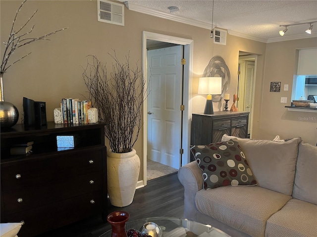 2500 Winding Creek Blvd Unit B105, Clearwater, FL 33761 - living room with wood finished floors, ornamental molding, a textured ceiling, and rail lighting
