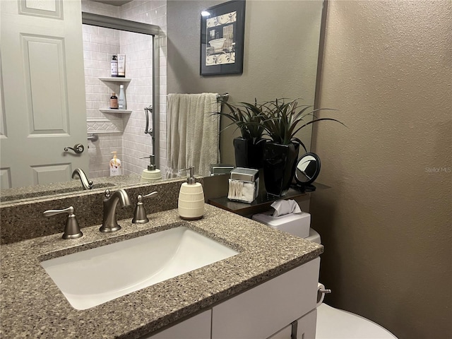 2500 Winding Creek Blvd Unit B105, Clearwater, FL 33761 - full bathroom featuring vanity, tiled shower, and a textured wall