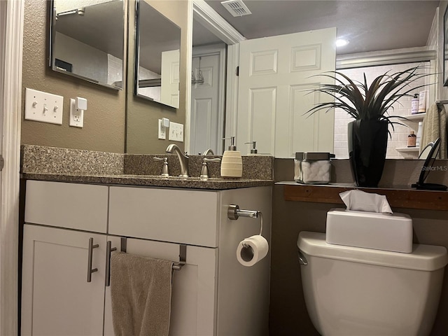 2500 Winding Creek Blvd Unit B105, Clearwater, FL 33761 - bathroom featuring toilet and vanity