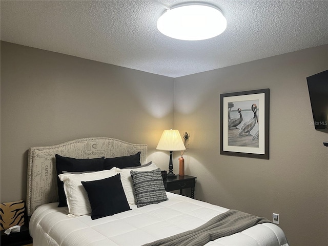 2500 Winding Creek Blvd Unit B105, Clearwater, FL 33761 - bedroom with a textured ceiling