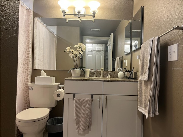 2500 Winding Creek Blvd Unit B105, Clearwater, FL 33761 - full bathroom featuring a textured wall and vanity
