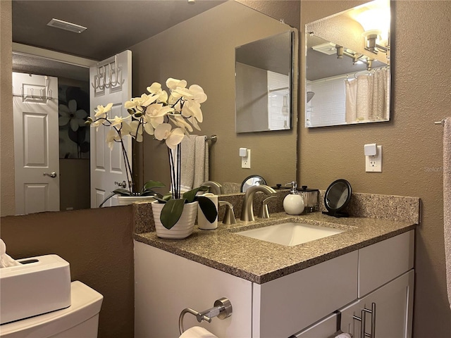 2500 Winding Creek Blvd Unit B105, Clearwater, FL 33761 - bathroom featuring vanity and a textured wall