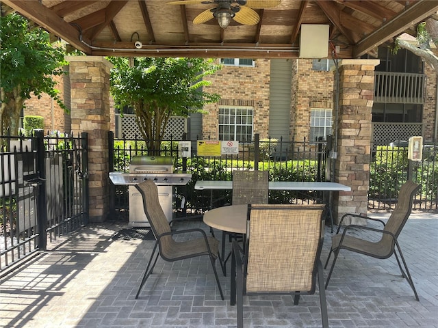 2500 Winding Creek Blvd Unit B105, Clearwater, FL 33761 - view of patio / terrace with ceiling fan, outdoor dining area, area for grilling, and a gazebo