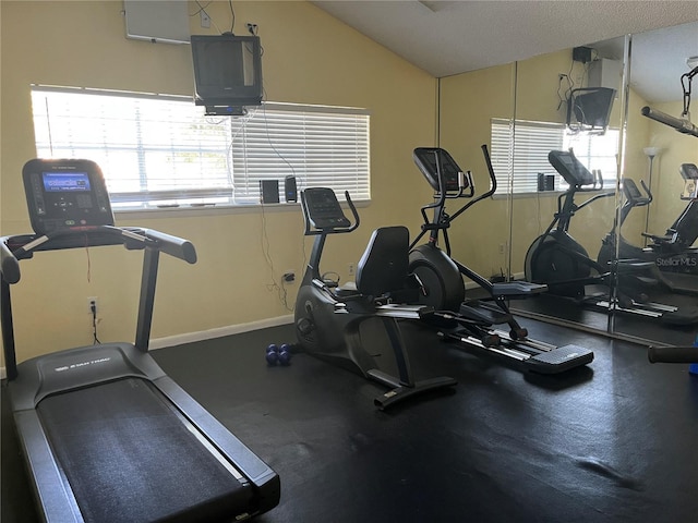 2500 Winding Creek Blvd Unit B105, Clearwater, FL 33761 - workout area featuring baseboards and vaulted ceiling