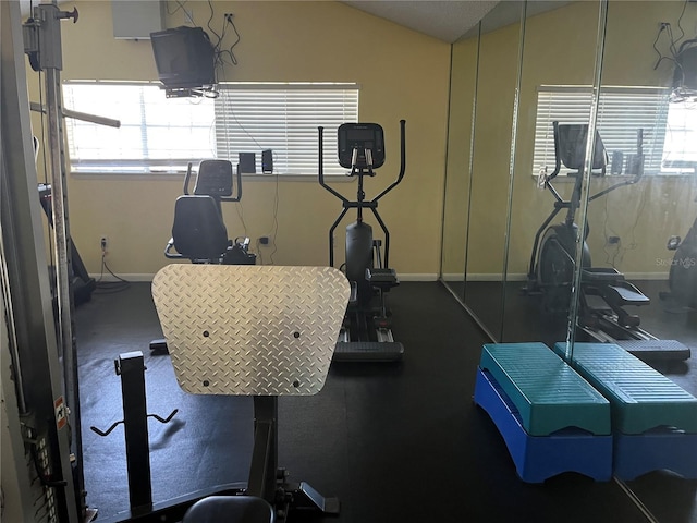 2500 Winding Creek Blvd Unit B105, Clearwater, FL 33761 - gym featuring baseboards and vaulted ceiling