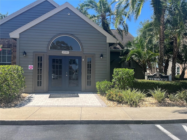 2500 Winding Creek Blvd Unit B105, Clearwater, FL 33761 - view of exterior entry featuring french doors