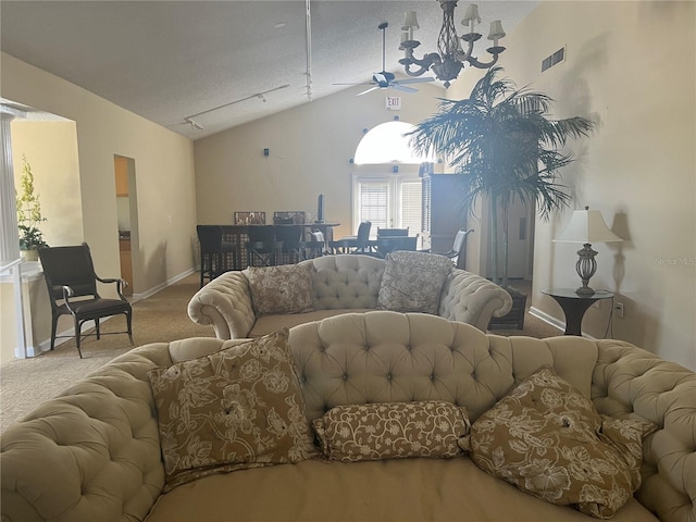 2500 Winding Creek Blvd Unit B105, Clearwater, FL 33761 - carpeted living area featuring lofted ceiling, a ceiling fan, and a textured ceiling