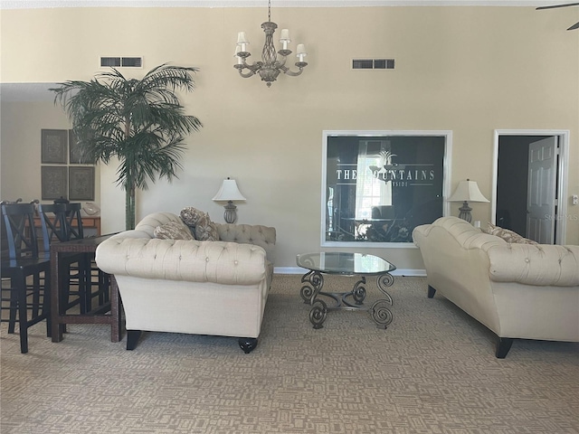 2500 Winding Creek Blvd Unit B105, Clearwater, FL 33761 - carpeted living area featuring a chandelier and a towering ceiling