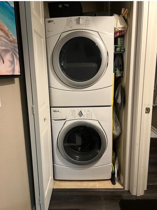 2500 Winding Creek Blvd Unit B105, Clearwater, FL 33761 - laundry room with stacked washer / dryer and wood finished floors