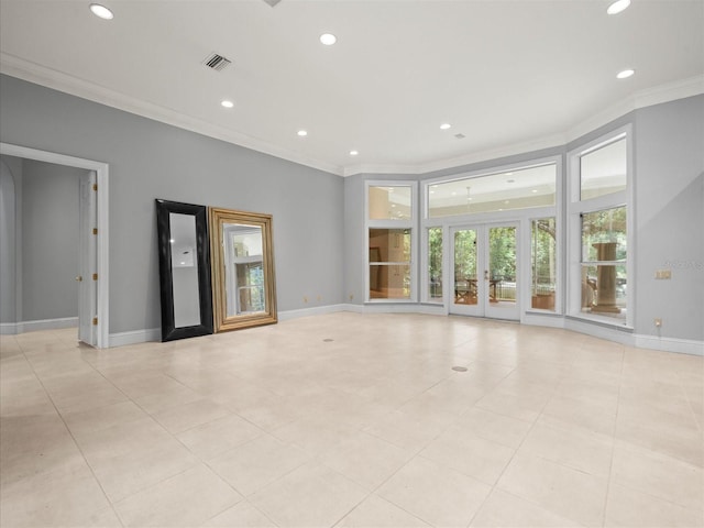 713 Argyle Pl, Temple Terrace, FL 33617 - empty room featuring crown molding, recessed lighting, french doors, and light tile patterned floors