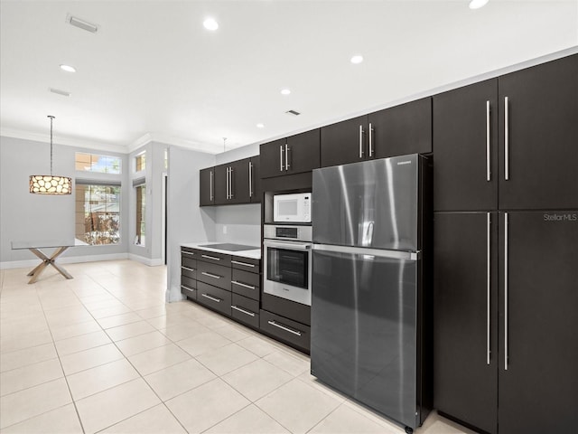 713 Argyle Pl, Temple Terrace, FL 33617 - kitchen featuring appliances with stainless steel finishes, dark cabinets, ornamental molding, light countertops, and light tile patterned flooring